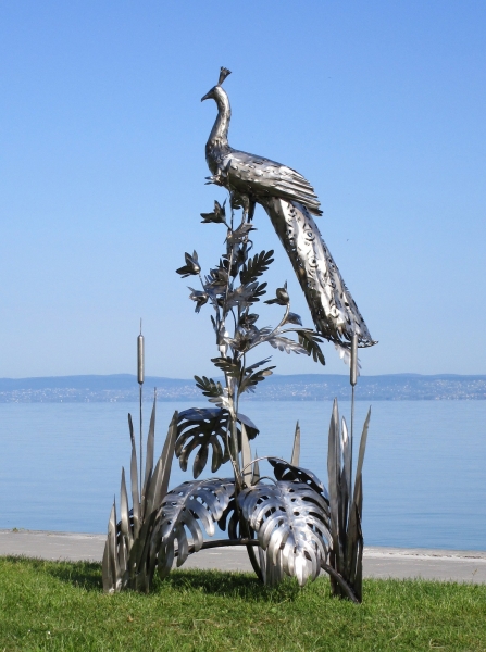 Peacock on tree garden sculpture rusty